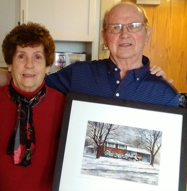 Lucy Schitos customers with the portrait of their home by Alex Krajewski commissioned by Lucy