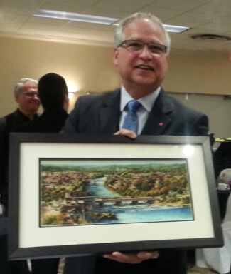 Presentation of Alex Krajewski's Cambridge print to the past MPP Gary Goodyear during a Cambridge Chember of Commerce morning event