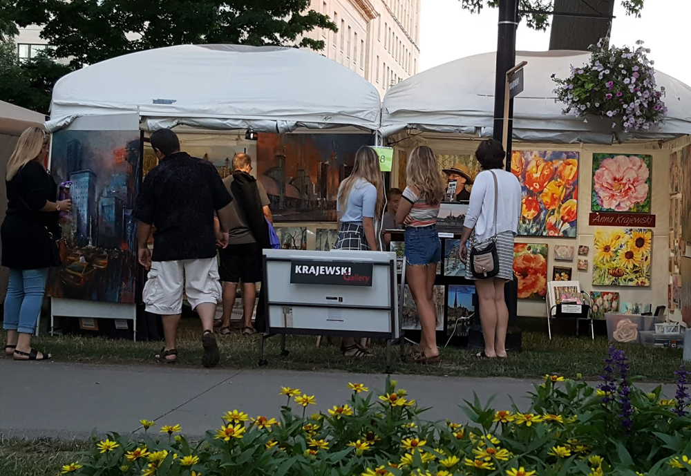 Canadian artists Alex Krajewski & Anna Krajewski booth Home County Folk Festival in London Ontario