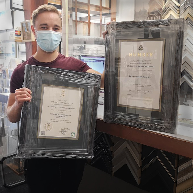 Framing of two college diplomas - during COVID pandemic