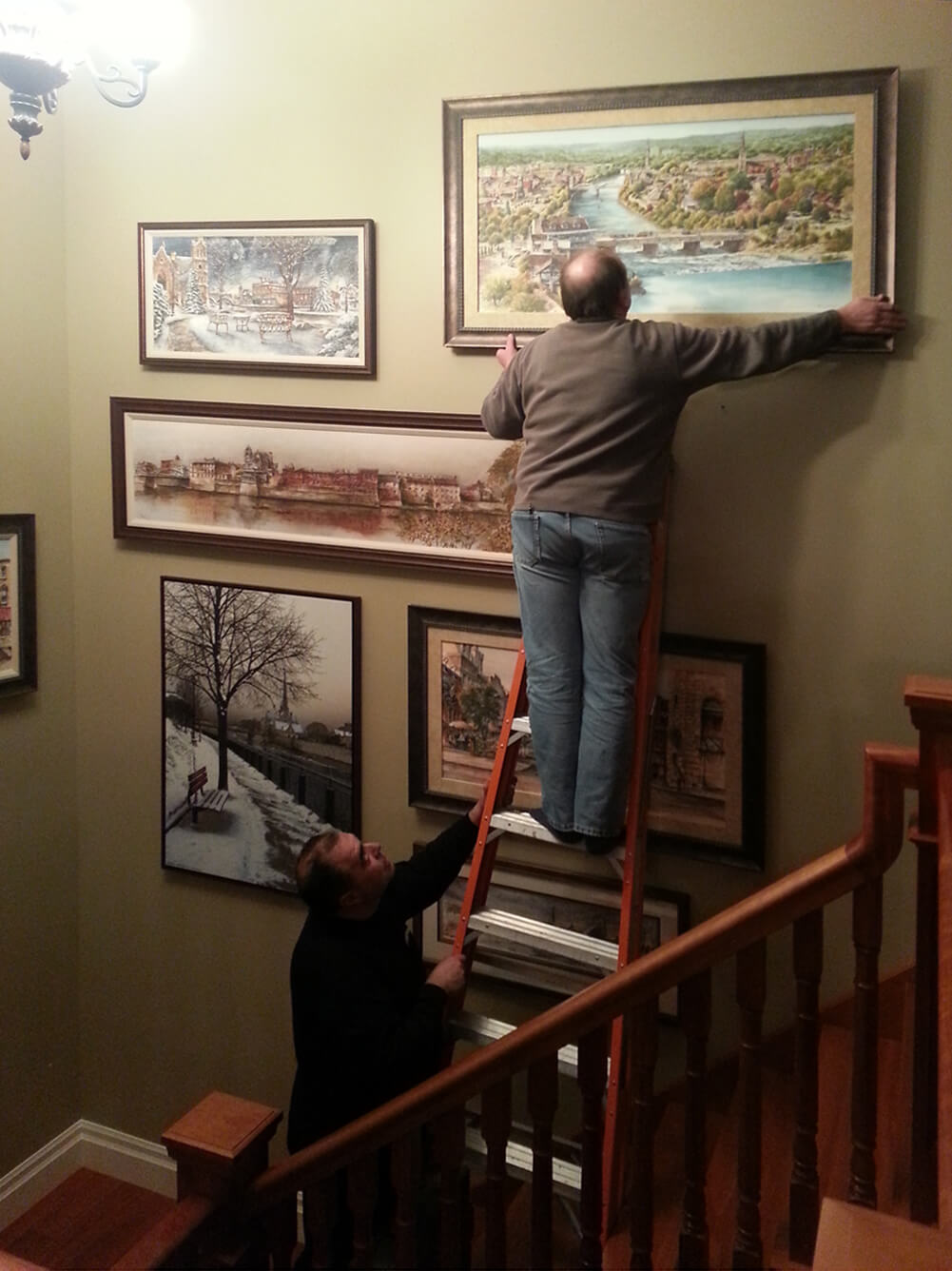 Adding Alex Krajewski's Cambridge Panorama-framed limited edition print on canvas to collection of prints at private home in St. George
